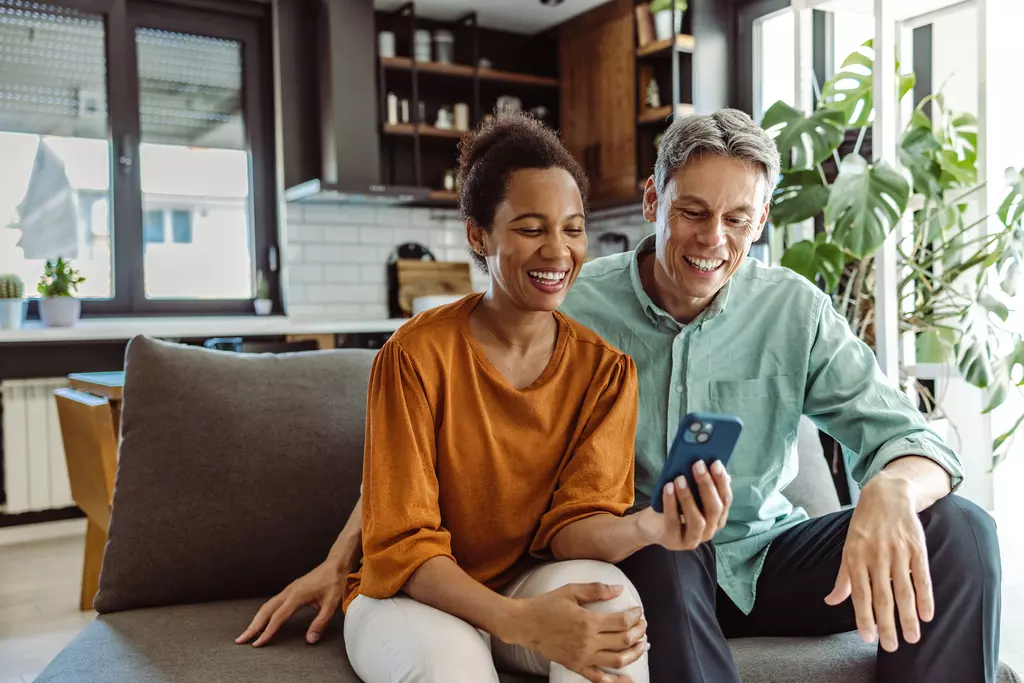 people checking phone looking happy 