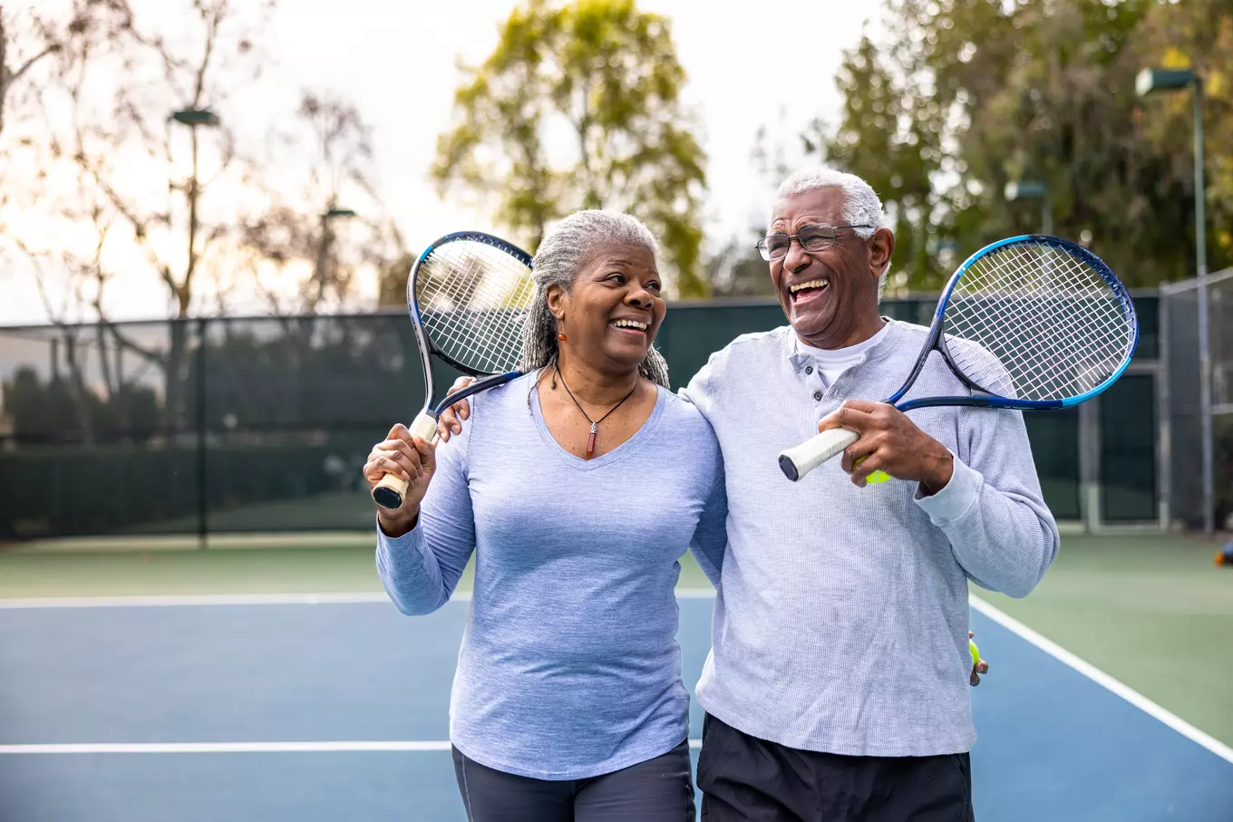 two people playing tennis.